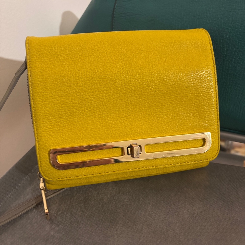 Vince Camuto Crossbody Bag. Yellow leather. Gray silk lining. Holds everything!